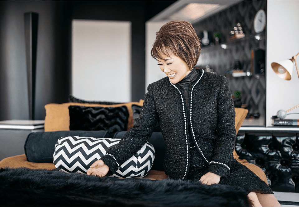 Maggie Chen sitting in modern living room